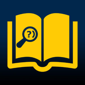 A magnifying glass on an open book